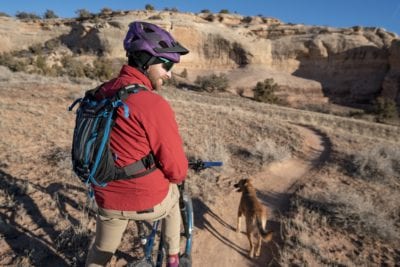 Taking a break with his trail dog, Tula, on the end of the Horsethief Bench trail.